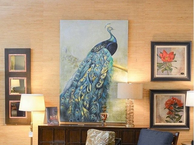 Painting of a peacock with table and other paintings of flowers 
