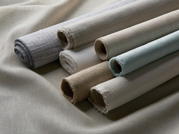 Rolls of drapery fabric